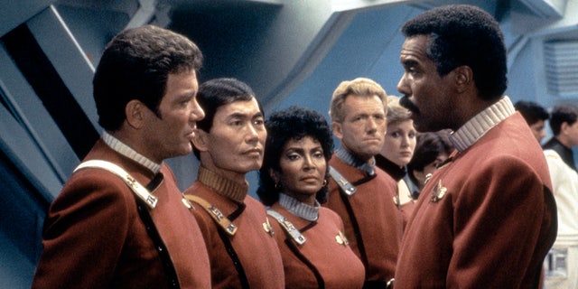 William Shatner, George Takei, Nichelle Nichols and Robert Hooks all on the set in their red uniforms for "Stark Trek III: The Search for Spock"