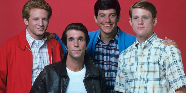 Fonzie (Henry Winkler), Richie (Ron Howard), Potsie (Anson WIlliams) and Ralph (Don Most) in a picture from season 2 of "Happy Days" with all men but Fonzie wearing plaid shirts