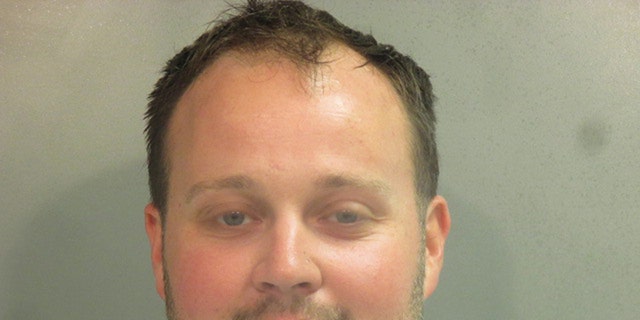 In this handout photo provided by the Washington County Sheriff’s Office, former television personality on "19 Kids And Counting" Josh Duggar poses for a booking photo after his arrest April 29, 2021, in Fayetteville, Ark. 