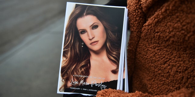 Programs at the public memorial included a portrait of Lisa Marie Presley.