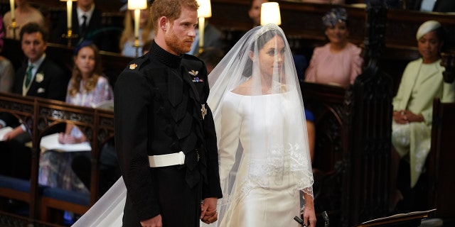 Prince Harry and Meghan Markle stand together for their wedding in St George's Chapel, Windsor Castle, in Windsor, England, on May 19, 2018.