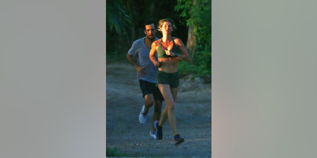 Gisele Bundchen jogs with her jiu-jitsu instructor Joaquim Valente in Costa Rica.