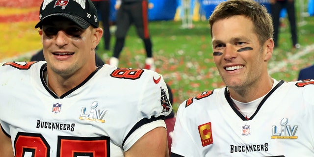 Rob Gronkowski, left, and Tom Brady of the Tampa Bay Buccaneers celebrate after defeating the Kansas City Chiefs in Super Bowl LV at Raymond James Stadium on Feb. 7, 2021, in Tampa, Florida.