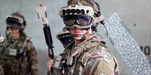 Soldiers wear a prototype of the U.S. Army's Integrated Visual Augmentation System and wield a Squad immersive Virtual Trainer during a training environment test event at its third Soldier Touchpoint at Fort Pickett, Va., Oct. 21, 2020.