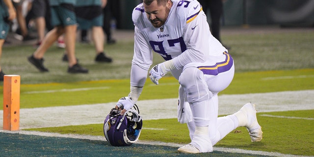 Minnesota Vikings defensive tackle Harrison Phillips, #97, takes a knee during the game between the Minnesota Vikings and the Philadelphia Eagles on September 19, 2022 at Lincoln Financial Field in Philadelphia.