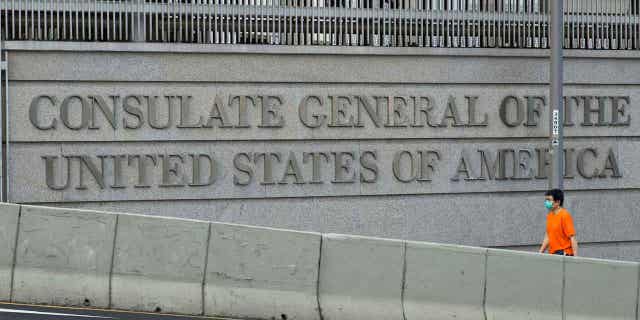 A man walks past the US Consulate in Hong Kong on Monday, March 15, 2021.