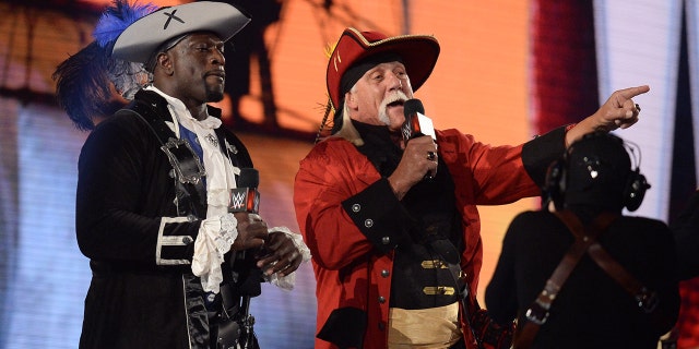 Apr 11, 2021; Tampa, Florida, USA; Titus O'Neil (left) and Hulk Hogan address fans during WrestleMania 37 at Raymond James Stadium.