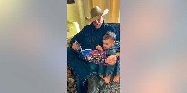 Sheriff Mark Lamb of Arizona reads his new book to his young grandson.