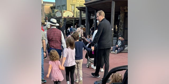 Marie Osmond shared a photograph   of Steve Craig walking manus  successful  manus  with their grandchildren astatine  Disney World.