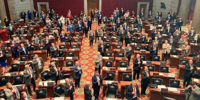 Members of the Missouri House of Representatives recite the Pledge of Allegiance as they begin their annual legislative session Wednesday, Jan. 5, 2022, in Jefferson City, Missouri.