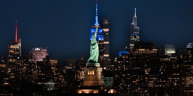 New York City with the Statue of Liberty in the foreground.