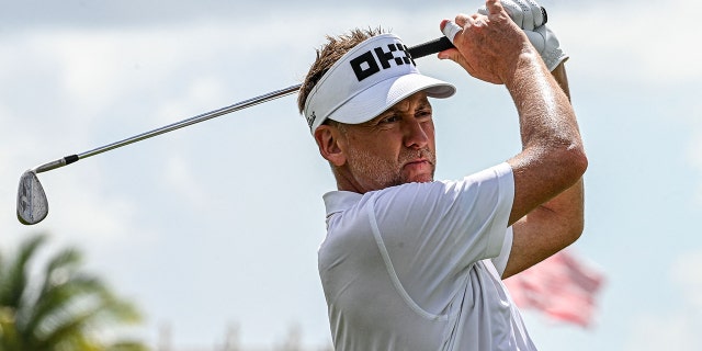 British golfer Ian Poulter plays his shot during the semifinals of the LIV Golf Invitational Miami 2022 at the Trump National Doral Miami Golf Club in Miami October 29, 2022.