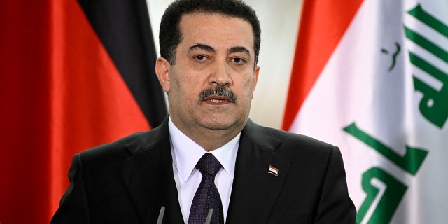 Iraq's Prime Minister Mohammed Shia al-Sudani and the German Chancellor (not in picture) give a joint press conference at the Chancellery in Berlin on January 13, 2023. 