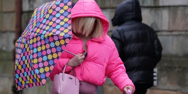 Isla Bryson, 31, formerly known as Adam Graham, from Clydebank, West Dunbartonshire, arrives at the High Court in Glasgow. 