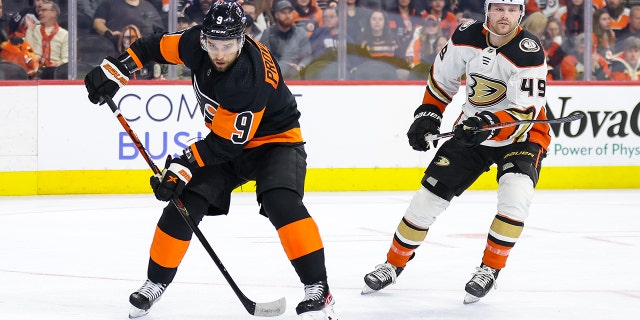 Ivan Provorov of the Flyers skates with the puck past Max Jones of the Anaheim Ducks on Jan. 17, 2023, in Philadelphia.