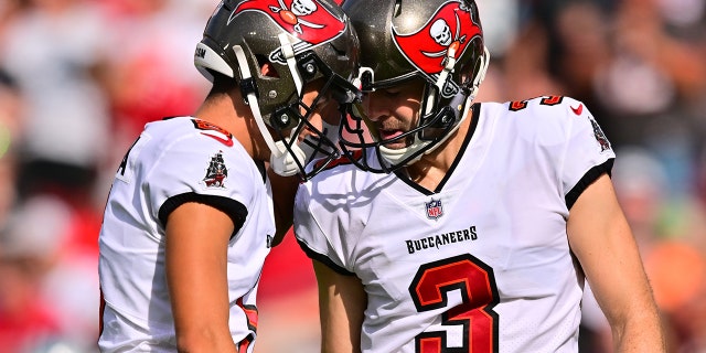 Ryan Succop #3 and Jake Camarda #5 of the Tampa Bay Buccaneers celebrate after a field goal during the second quarter against the Carolina Panthers at Raymond James Stadium on January 01, 2023 in Tampa, Florida. 