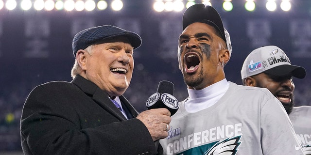 Philadelphia Eagles quarterback Jalen Hurts, center, reacts while speaking toTerry Bradshaw, left, after the NFC Championship NFL football game between the Philadelphia Eagles and the San Francisco 49ers on Sunday, Jan. 29, 2023, in Philadelphia.