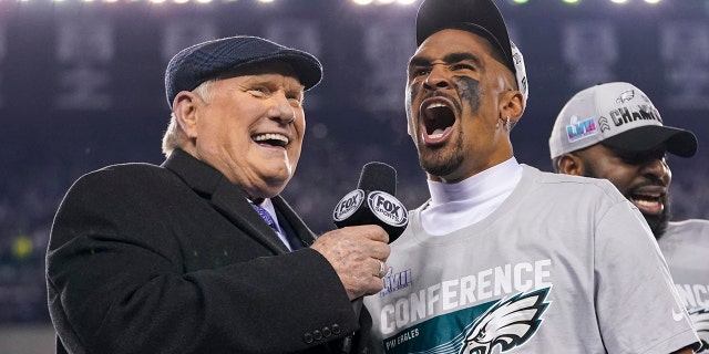 Philadelphia Eagles quarterback Jalen Hurts, center, reacts while speaking toTerry Bradshaw, left, after the NFC Championship NFL football game between the Philadelphia Eagles and the San Francisco 49ers on Sunday, Jan. 29, 2023, in Philadelphia.