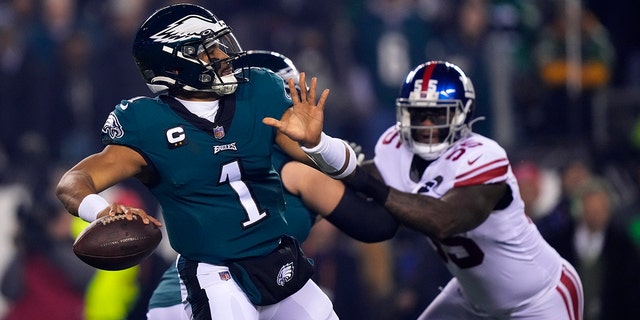 Eagles quarterback Jalen Hurts prepares to throw against the New York Giants during the divisional round playoff football game, Saturday, Jan. 21, 2023, in Philadelphia.