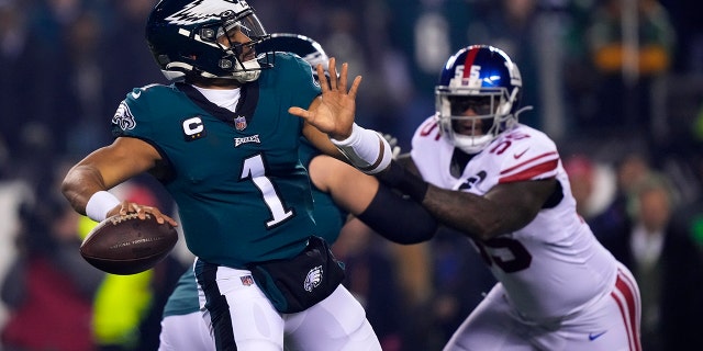 Eagles quarterback Jalen Hurts prepares to throw against the New York Giants during the divisional round playoff football game, Saturday, Jan. 21, 2023, in Philadelphia.