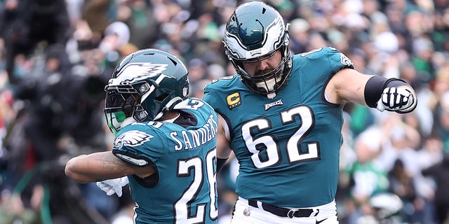 Miles Sanders (26) of the Philadelphia Eagles celebrates with Jason Kelce (62) after scoring a 6-yard touchdown against the San Francisco 49ers during the first quarter in the NFC Championship Game at Lincoln Financial Field January 29, 2023 in Philadelphia.