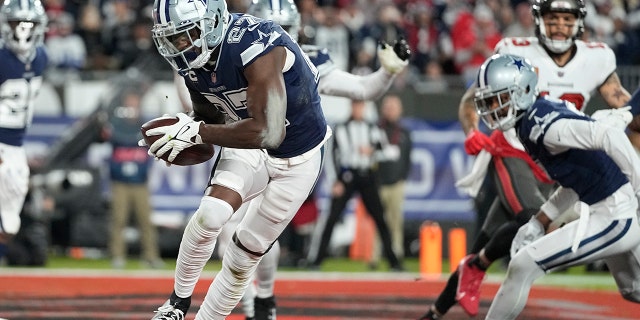 Dallas Cowboys safety Jayron Kearse (27) runs in the end zone after his interception against the Tampa Bay Buccaneers during the first half of an NFL wild card game, Monday, Jan. 16, 2023, in Tampa, FL. 