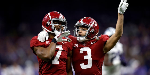 Ja'Corey Brooks, left, of the Alabama Crimson Tide reacts with Jermaine Burton after scoring a touchdown against the Kansas State Wildcats on Dec. 31, 2022, in New Orleans.