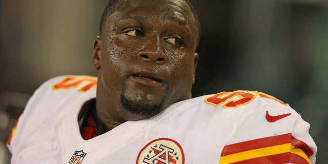 Jerrell Powe #95 of the Kansas City Chiefs rests on the sidelines during a preseason game against the Green Bay Packers at Lambeau Field on August 30, 2012 in Green Bay, Wisconsin.