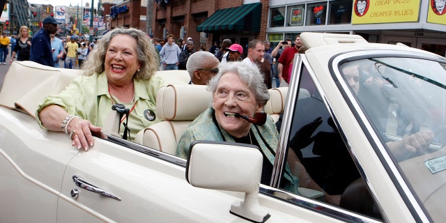 Jerry Lee Lewis greets fans with seventh wife Judith Brown during a parade down Beale Street in Memphis, Tennessee, on April 27, 2013.