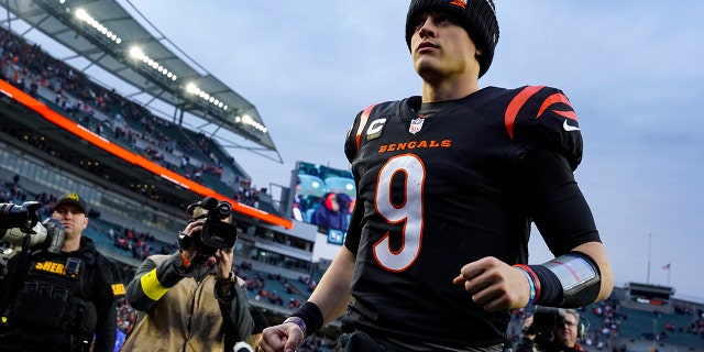 Cincinnati Bengals quarterback Joe Burrow runs off the field after an NFL football game against the Baltimore Ravens in Cincinnati on January 8, 2023.