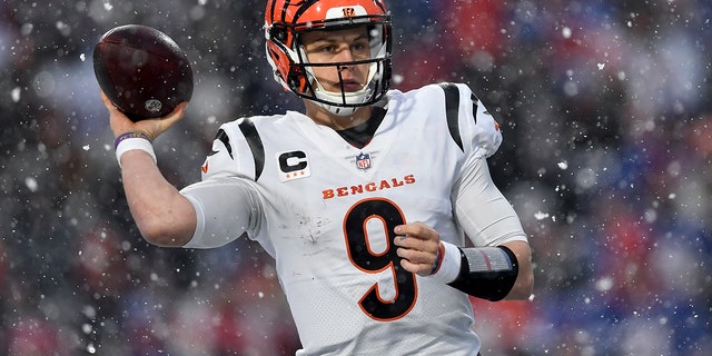 Cincinnati Bengals quarterback Joe Burrow passes against the Buffalo Bills during the third quarter of an NFL division round playoff game, Sunday, Jan. 22, 2023, in Orchard Park, New York.