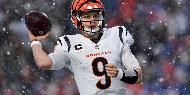 Cincinnati Bengals quarterback Joe Burrow passes against the Buffalo Bills during the third quarter of an NFL divisional round playoff game, Sunday, Jan. 22, 2023, in Orchard Park, New York.