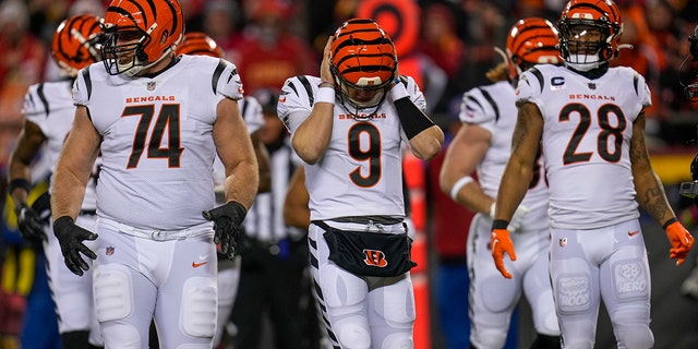 Cincinnati Bengals quarterback Joe Burrow (9) covers his ears to catch a play in the first quarter of the AFC Championship Game against the Kansas City Chiefs, Sunday, Jan. 29, 2023, at the Arrowhead Stadium in Kansas City, Missouri.