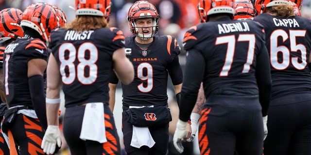 Joe Burrow, number 9 of the Cincinnati Bengals, joins his team in the first quarter against the Baltimore Ravens at Paycor Stadium on January 8, 2023 in Cincinnati.