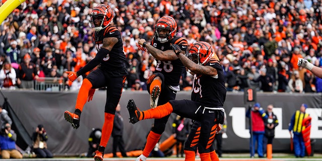 Cincinnati Bengals running back Joe Mixon, center, celebrates a touchdown against the Baltimore Ravens in the first half of a game in Cincinnati on Sunday, January 8, 2023. 
