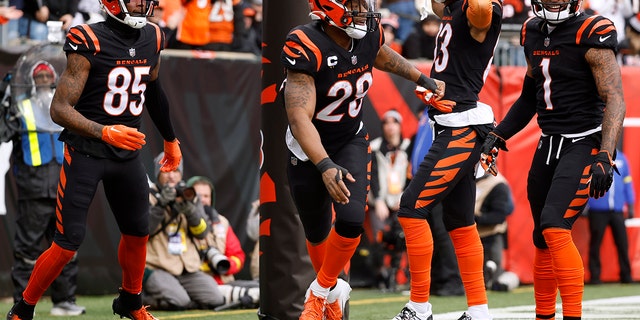 Joe Mixon of the Bengals celebrates his touchdown with teammates against the Baltimore Ravens at Paycor Stadium on Jan. 8, 2023, in Cincinnati.