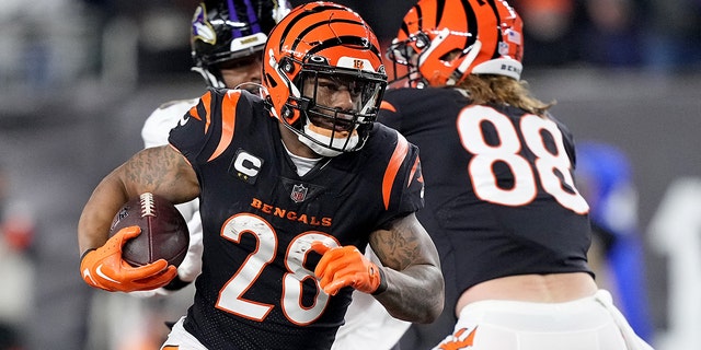 Joe Mixon #28 of the Cincinnati Bengals rushes the ball during the first quarter in an AFC Wild Card Playoff game against the Baltimore Ravens at Pecor Stadium on January 15, 2023 in Cincinnati, Ohio.