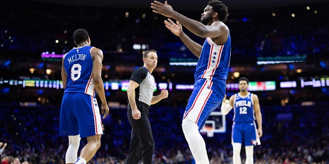 Jan 25, 2023; Philadelphia, Pennsylvania; Philadelphia 76ers center Joel Embiid (21) reacts after his score and one during the third quarter against the Brooklyn Nets at Wells Fargo Center.