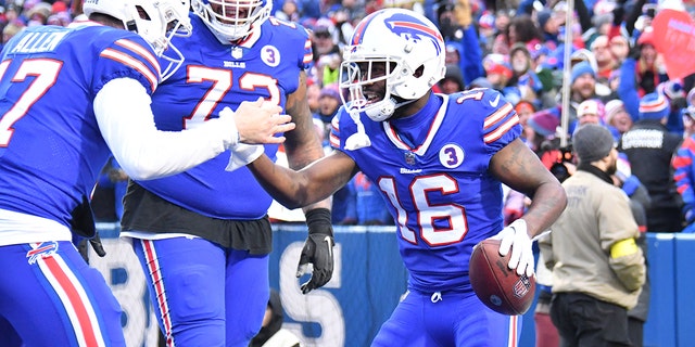 January 8, 2023;  Orchard Park, New York, USA;  Buffalo Bills wide receiver John Brown (16) celebrates a touchdown with quarterback Josh Allen (17) and offensive lineman Dion Dawkins (73) during the third quarter against the New England Patriots at Highmark Stadium.