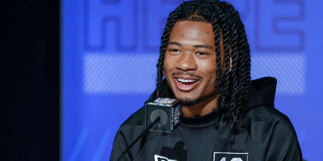 John Metchie #WO18 of the Alabama Crimson Tide speaks to reporters during the NFL Draft Combine at the Indiana Convention Center on March 2, 2022 in Indianapolis, Indiana.