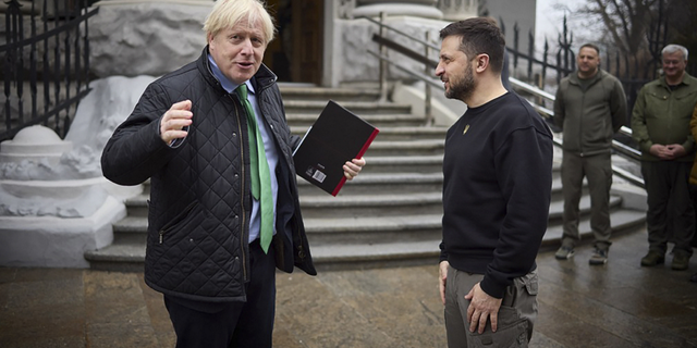 Ukrainian President Volodymyr Zelenskyy, right, and former British Prime Minister Boris Johnson talk during their meeting in Kyiv, Ukraine, on Sunday, Jan. 22.