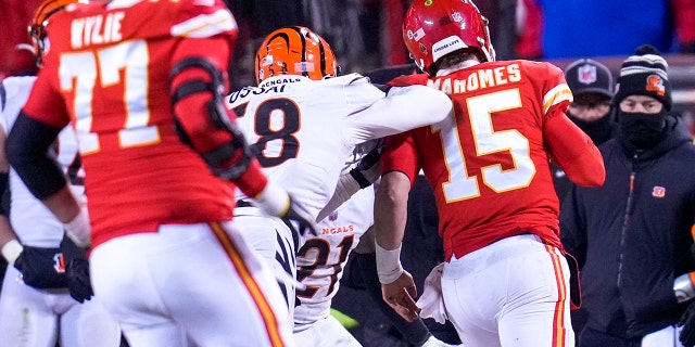 Kansas City, Missouri, USA; Cincinnati Bengals defensive end Joseph Ossai (58) shoves Kansas City Chiefs quarterback Patrick Mahomes (15) as he scrambles out of bounded, resulting in a roughing the passer penalty, and putting the Chiefs in field goal position in the fourth quarter of the AFC championship NFL game between the Cincinnati Bengals and the Kansas City Chiefs, Sunday, Jan. 29, 2023, at Arrowhead Stadium in Kansas City, Mo.