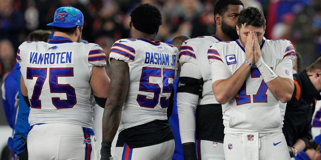 Buffalo Bills quarterback Josh Allen (17) pauses as Damar Hamlin is examined during the first half of an NFL football game against the Cincinnati Bengals, Monday, Jan. 2, 2023, in cincinnati.