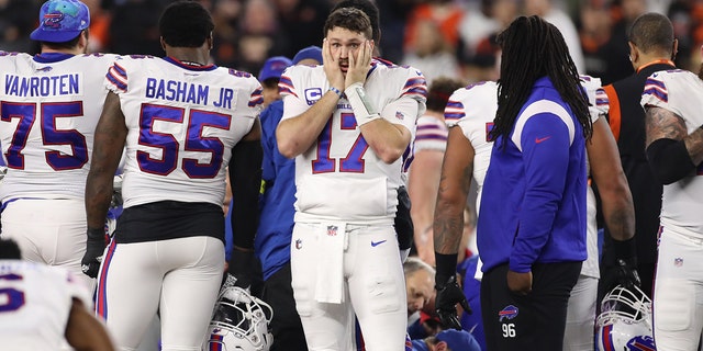 Buffalo Bills quarterback Josh Allen, #17, reacts as medical personnel attend to Buffalo Bills safety Damar Hamlin.