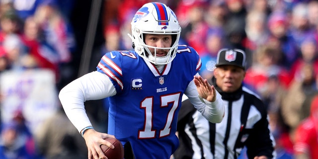 Josh Allen of the Buffalo Bills scrambles against the Miami Dolphins in the AFC wild-card playoff game at Highmark Stadium on Jan. 15, 2023, in Orchard Park, New York.