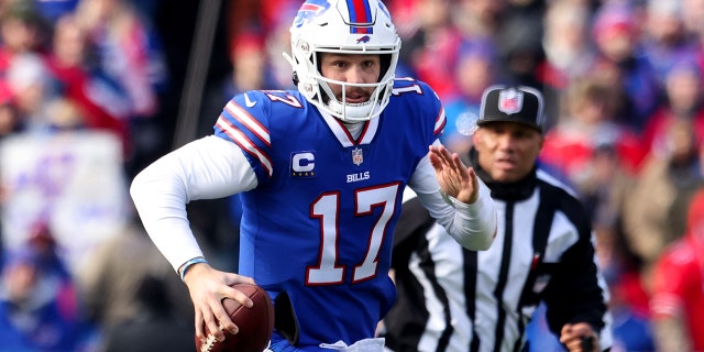 Josh Allen of the Buffalo Bills scrambles against the Miami Dolphins in the AFC wild-card playoff game at Highmark Stadium on Jan. 15, 2023, in Orchard Park, New York.