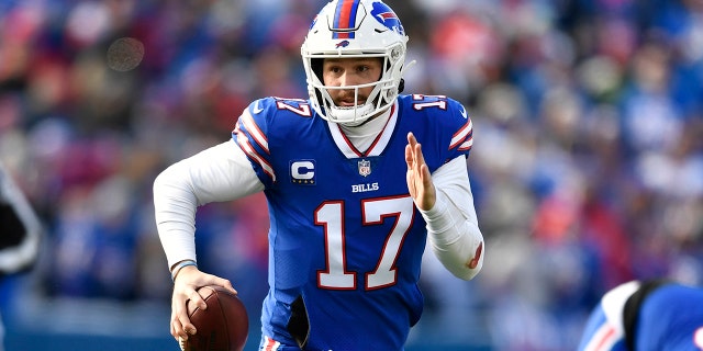 Buffalo Bills quarterback Josh Allen (17) looks for a pass during the first half of an NFL Wild Card playoff football game against the Miami Dolphins, Sunday, Jan. 15, 2023, in Orchard Park, New York.