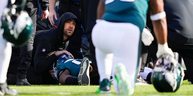 Eagles defensive end Josh Sweat is treated after injuring himself during a New Orleans Saints game in Philadelphia on Sunday, January 1, 2023.