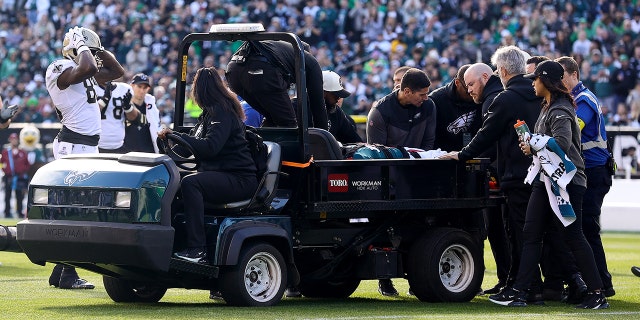 The Eagles' Josh Sweat is carried off the field following an injury at Lincoln Financial Field on January 1, 2023 in Philadelphia.