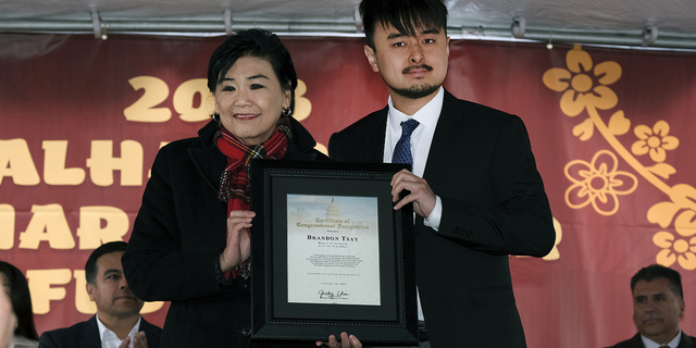 Congresswoman Judy Chu representing the 28th District of California presents Brandon Tsay with a Congressional Certificate of Recognition on Sunday, Jan. 29, in Alhambra, California.